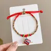 Pulsera de Hilo Rojo de Bebé de Dibujos Animados 2026 Nuevo Estilo Bendición Pequeño Zongzi Pulsera Estilo Chino Festival del Bote del Dragón Hilo de Cinco Colores Ajustable Venta al por Mayor