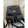 Mochila de alta calidad estilo Chanel para mujer, modelo nuevo 2026 en patrón de diamante rosa, versátil con múltiples bolsillos y asa de cadena