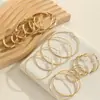 Pendientes Metálicos Minimalistas Estilo 2026 con Círculos Grandes, Presentando un Diseño Sofisticado y de Alta Gama