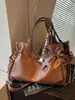 Bolso grande de moda retro para mujer 2026 nuevo bolso casual simple para el antebrazo bolso tote de hombro texturizado para el trabajo