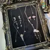 Aretes de aguja plateada con diamantes, borlas geométricas de perlas, ultra brillantes, lujosos y exquisitos, personalizados y elegantes, aretes de alta gama