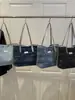 Bolsa Jeans para Mulheres 2025 Nova Tendência Moda Nicho Simples Ombro Transversal Versátil Bolsa Tote Exportação