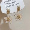 Pendientes de temperamento súper hada con pequeñas flores frescas y perlas naturales, para mujer, nicho, exquisitos, versátiles, de alta gama, joyería para las orejas