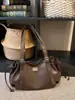 Bolsa Transfronteiriça 2025 Novo Modelo para o Dia a Dia Leve Luxo Retrô com Cordão Bolsa Baguete Nicho Ombro Único Sob o Braço Bolsa de Mão Casual Feminina