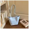 Bolso de mano de nicho estilo coreano, bolso tote pequeño para mujer, bolso cubo de nailon de gran capacidad, bolso de hombro tipo cesta simple
