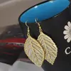 Recolección Transfronteriza de Pendientes Metálicos con Hojas Geométricas Escarchadas, Ganchos para Orejas Creativos Personalizados con Borla de Hoja Redonda Hueca