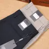 Serie Z Jie Jia Nuevos pantalones casuales de negocios para hombre finos de primavera y verano de Tencel y algodón de fibra larga elásticos lisos sin planchado antiarrugas