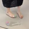 Sapatos Baixos Vazados para Mulheres 2025 Novo Verão Transparente Sola Macia Sapatos de Geléia Moda Flor Sandálias Rasteiras de Bico Baixo com Furos