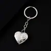 Llavero de metal con forma de corazón y diseño de plantas transfronterizo, espejo con acabado espejo para bricolaje, puede contener fotos, llavero de acero inoxidable