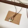 Collar con colgante de metal y piedra ojo de tigre minimalista de moda, un diseño único y elegante, perfecto para combinar con suéteres
