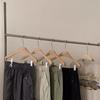 Saia de Alta Qualidade Estilo Workwear 2026 com Bolsos de Cordão, Saia Primavera/Verão com Fenda nas Costas, Saia de Cintura Alta de Comprimento Médio