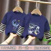 Camiseta de manga larga de algodón puro para niño, nuevo modelo primavera y otoño 2026, camiseta básica con estampado de dibujos animados para niño, top falso de dos piezas, moderno