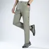 Fábrica de comercio exterior venta directa pantalones deportivos de secado rápido para exteriores para hombre, holgados, elásticos, multibolsillos, pantalones de montañismo de comercio exterior