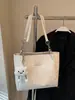 Nuevos bolsos de mano para otoño e invierno, bolsos tote versátiles, bolsos de hombro de gran capacidad, estilo simple y de lujo ligero, bolsos casuales para el día a día con un tacto de calidad