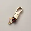 Directo de fábrica llavero de cuerda tejida accesorios de ferretería hebilla de herradura colgante para llave de coche accesorios de coche de moda