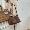 Bolso tejido personalizado transfronterizo para mujer, nuevo modelo 2026, textura de alta calidad, estilo nicho, bolso versátil de hombro y axila