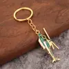Chaveiro de liga de personalidade criativa de helicóptero e carro de desenho animado, pingente para mochila de estudante, um par de pequenos presentes ins, atacado