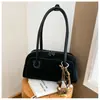 Bolso de axila retro de nicho para mujer, nueva moda otoño/invierno 2026, elegante bolso de hombro para el trabajo y los desplazamientos, bolso baguette simple