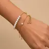 Pulsera de oro de 18 quilates con perla de imitación ovalada, cuentas de oro y cadena de acero inoxidable, ajustable, joyería de mano transfronteriza europea y americana