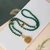 Nuevo estilo chino estilo antiguo arena dorada diamante rosa flor de rosa ventana brújula flor de sol hueca cadena de suéter de seda jade malayo