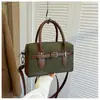Moda transfronteriza popular diseño de nicho Bolso Boston para mujer para ir al trabajo 2026 Otoño/Invierno nuevo bolso cruzado de un solo hombro mate