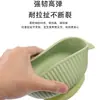 Tazón de alimentación para bebé de silicona de grado alimenticio con doble asa, diseño antiquemaduras y ventosa integrada para la autoalimentación infantil.