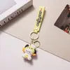 Lindo Colgante Llavero Sanrio Dibujo Animado Kuromi Perro de Orejas Grandes Colgante para Bolsa Ciudad de Arcade Pequeño Regalo Al Por Mayor