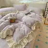 Conjunto de cama de quatro peças em renda francesa de grau A de inverno com veludo de leite, apresentando uma capa de edredom de fleece dupla face e um lençol de cama de veludo coral de fleece