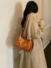 2026 Nueva Bolsa de Axila de Cuero Encerado Retro para Mujer Diseño de Nicho de Alta Gama Bolso de Hombro Único Versátil para Viajar Bolso Cruzado