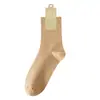 Calcetines sin costuras para hombre de otoño e invierno, antibacterianos y resistentes al olor, color liso, calcetines de media pantorrilla para uso diario y de negocios, algodón puro, venta al por mayor de la industria de calcetines de Zhuzji