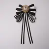 Estilo transfronterizo más vendido broche de corsage con lazo de pedrería a rayas decoración para camisa corbata cuello accesorios de flor