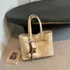 Bolso tote nuevo de 2026, estilo francés, moderno, retro, versátil y práctico, de gran capacidad, adecuado para ir al trabajo; un bolso de hombro o bolso cruzado de gama alta