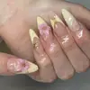 Unhas postiças de comprimento curto mais vendidas da Amazon com estrelas douradas e flores, estilo elegante para meninas, unhas postiças