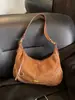 Bolsa Feminina Transfronteiriça Estilo Bolinho Feminina Versátil para o Dia a Dia Bolsa Transversal Bolsa Meia-Lua 2026 Nova Bolsa de Ombro em Camurça Bolsa de Axila