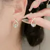 Brincos Koreanos Exquisitos de Diamante Cruzados Acessíveis Luxo Elegante Nicho Design de Ponta Ouro Prata Estilosos