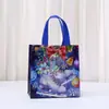 Bolsa de Regalo Navideña de Comercio Exterior Bolso de Mano No Tejido Recubierto con Láser Nochebuena Gran Capacidad Bolsa para Dulces y Regalos Mayoreo