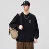 Camiseta de manga larga de alta calidad y moderna para hombre, estilo primavera y otoño, elegante y versátil, top casual de punto redondo con estampado negro