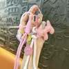 Pingente de chaveiro de bolsa com borla de filhote de liga transfronteiriça, pingente fofo para mochila, chaveiro de carro, atacado de comércio exterior