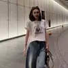 Camiseta Trendy Retro Americana con Estampado de Letras Cuello Redondo para Mujer Verano 2026 Nuevo Algodón Puro Versátil Manga Corta Top Trendy
