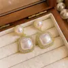 Pendientes de Ojo de Gato con Diamantes Completos de Lujo Ligero para Mujer, Nuevos Pendientes Vintage para Socialité 2026, Perlas Versátiles de Alta Gama