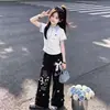2026 Novo Estilo de Verão Doce Camisa Polo Manga Curta Hello Kitty com Calça de Perna Larga com Renda, Conjunto de Duas Peças Casual e Confortável