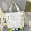 Mochila estilosa 2026 para meninas do ensino fundamental, com estampa fofa de bolinhas, múltiplos compartimentos e um design adequado para alunos do ensino fundamental como uma bolsa tote.