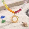 Joyería transfronteriza europea y americana: Collar de acero inoxidable con colgante de sol hueco y cuentas de cristal multifacético de colores del arcoíris para mujer