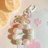 Llavero Colgante de Coche con Lazo de Perlas Electrochapado Color Caramelo Pintura para Hornear Hebilla Pequeña para Puerta Accesorios de Perla Bolsa