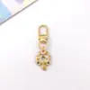 Colgante de gatito lindo de aleación estilo japonés Llavero de coche mini Colgante para AirPods Accesorio para bolso pequeño