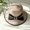 Sombrero femenino verano estilo coreano lazo grande sombrero de paja de playa viaje vacaciones protección solar sombrero para el sol sombrero de paja tejido estilo Chanel tipo cubo