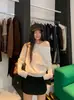 Suéter casual de hombros descubiertos para mujer, nueva colección otoño e invierno 2026, top de punto asimétrico de corte holgado, elegante top interior