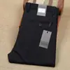 Pantalones de negocios casual para hombre, finos, de color liso, frescos, ultradelgados, alta elasticidad, nailon, sin planchado, antiarrugas, primavera y verano 2024