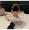 Bolsa de mão com padrão de lichia moda transfronteiriça bolsa pequena feminina nova bolsa balde retrô de alto valor bolsa de ombro única estilosa bolsa transversal