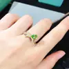 Anillo de diopsita explosiones naturales directo de fábrica plata S925 decoración femenina piedra principal 5*7 cruz caliente transfronterizo una generación de cabello